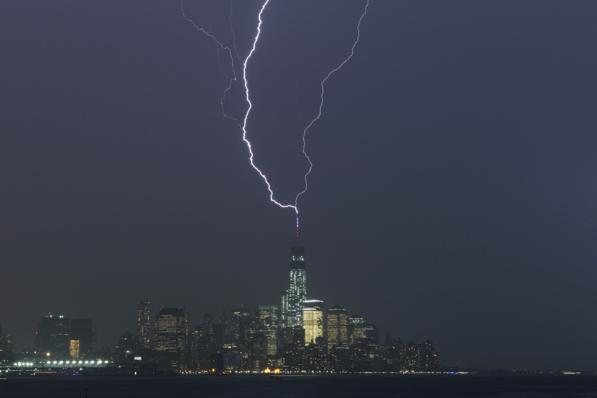 Two bolts of lightning hit the antenna on top of One World Trade Center in Lower Manhattan as an ele